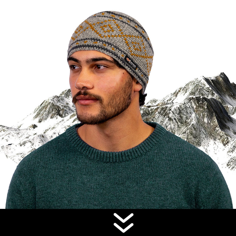 Woman wearing a white Everest Designs Nepali wool Cable Cuff Beanie